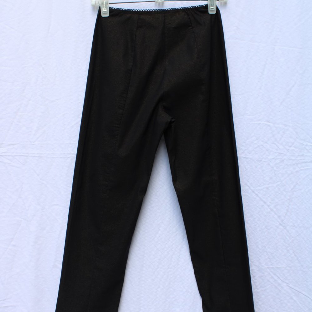 Black Mesmerize pants with a golden shift